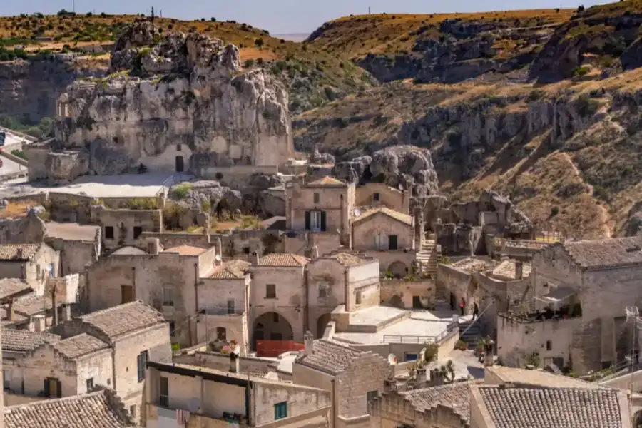 The Sassi of Matera, a stone hill town in southern Italy, the kind of comune where the 7% flat-tax regime for foreign pensioners applies