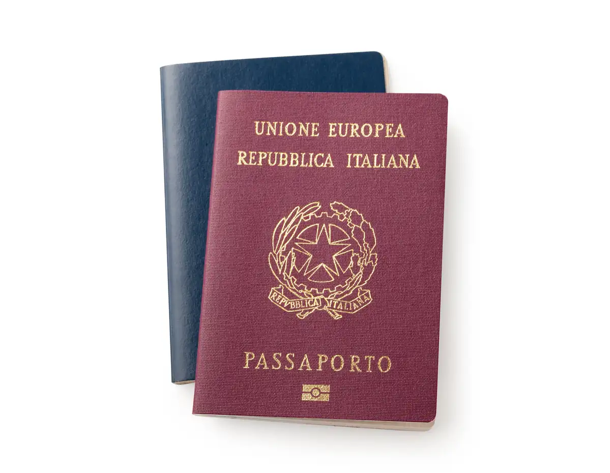 An Italian passport resting on a U.S. passport, citizenship and residence under the U.S.-Italy tax treaty