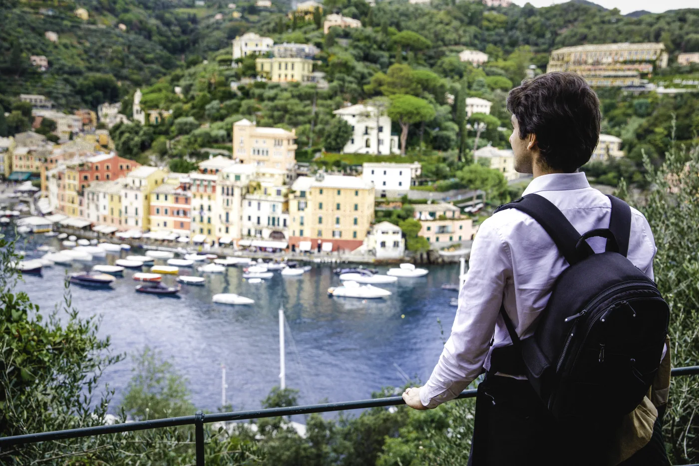 American expat overlooking Portofino harbor in Italy