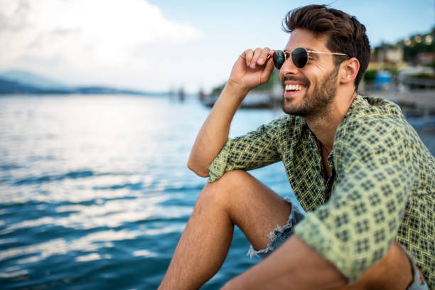 American relaxing by an Italian lake