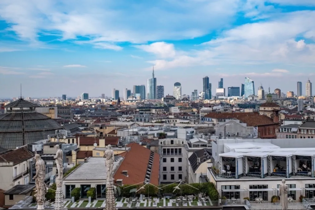 Milan skyline with Duomo statues in front of the Porta Nuova business district